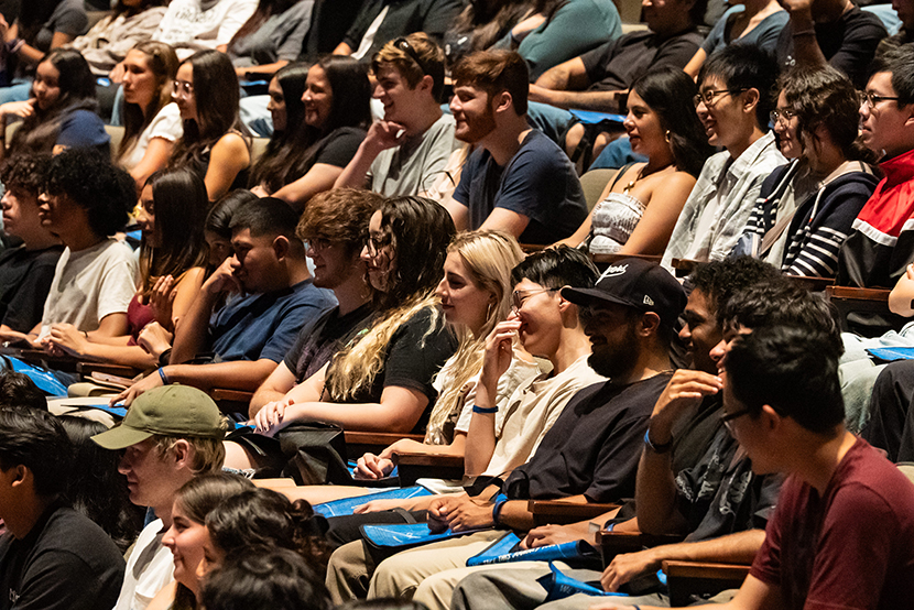 A group of students sitting in theater seats