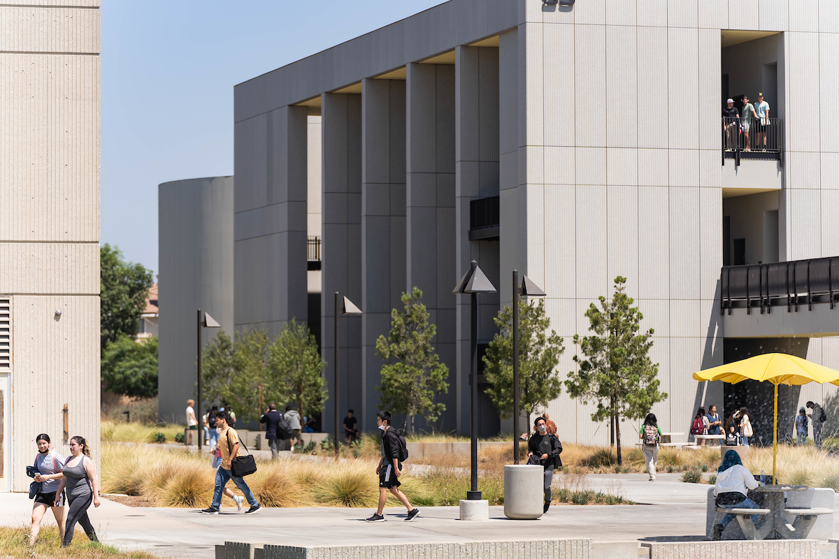 Students walk past the Science, Engineering, and Math building on the Cypress College campus