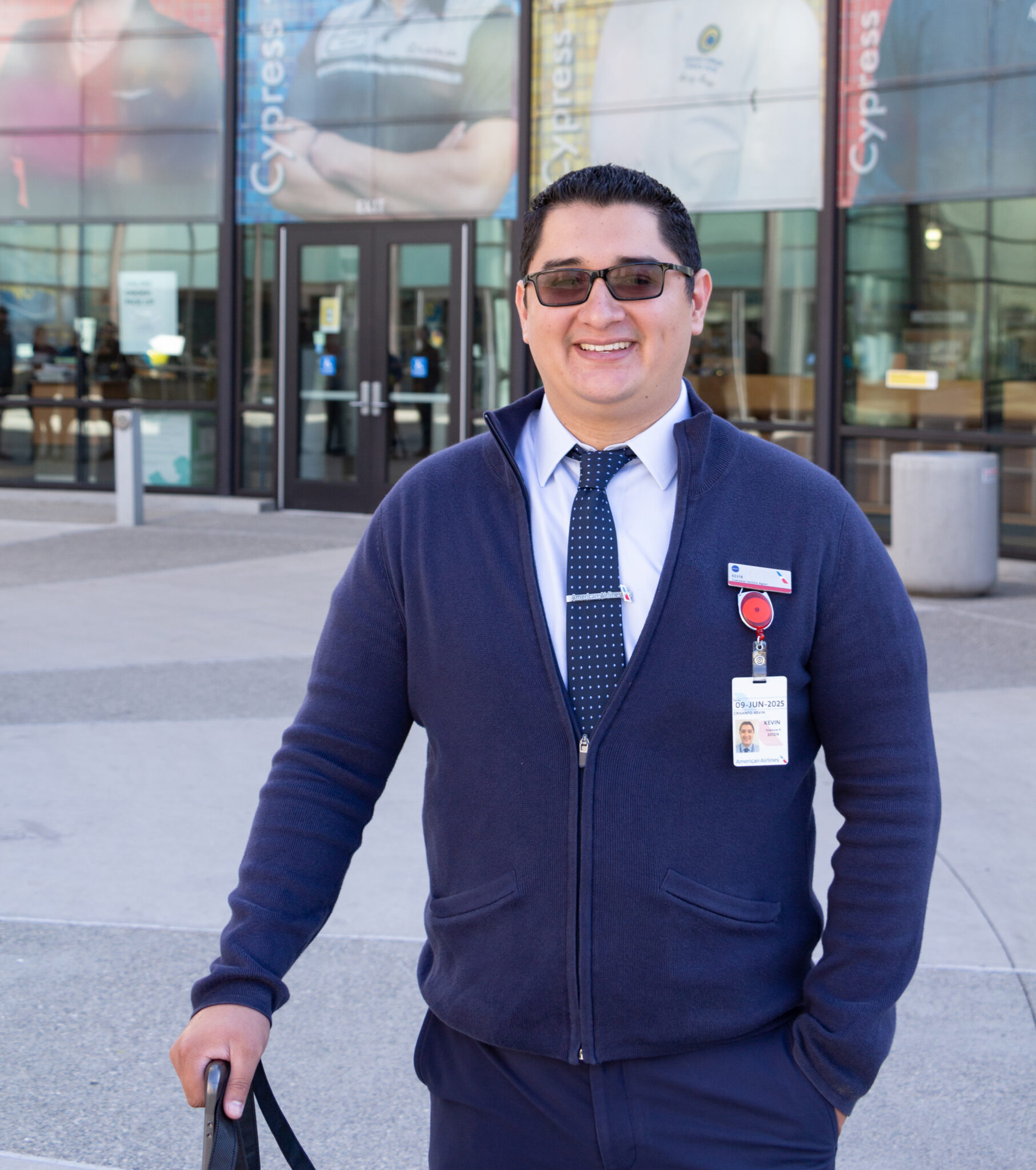 Kevin Crisanto poses in American Airlines uniform.