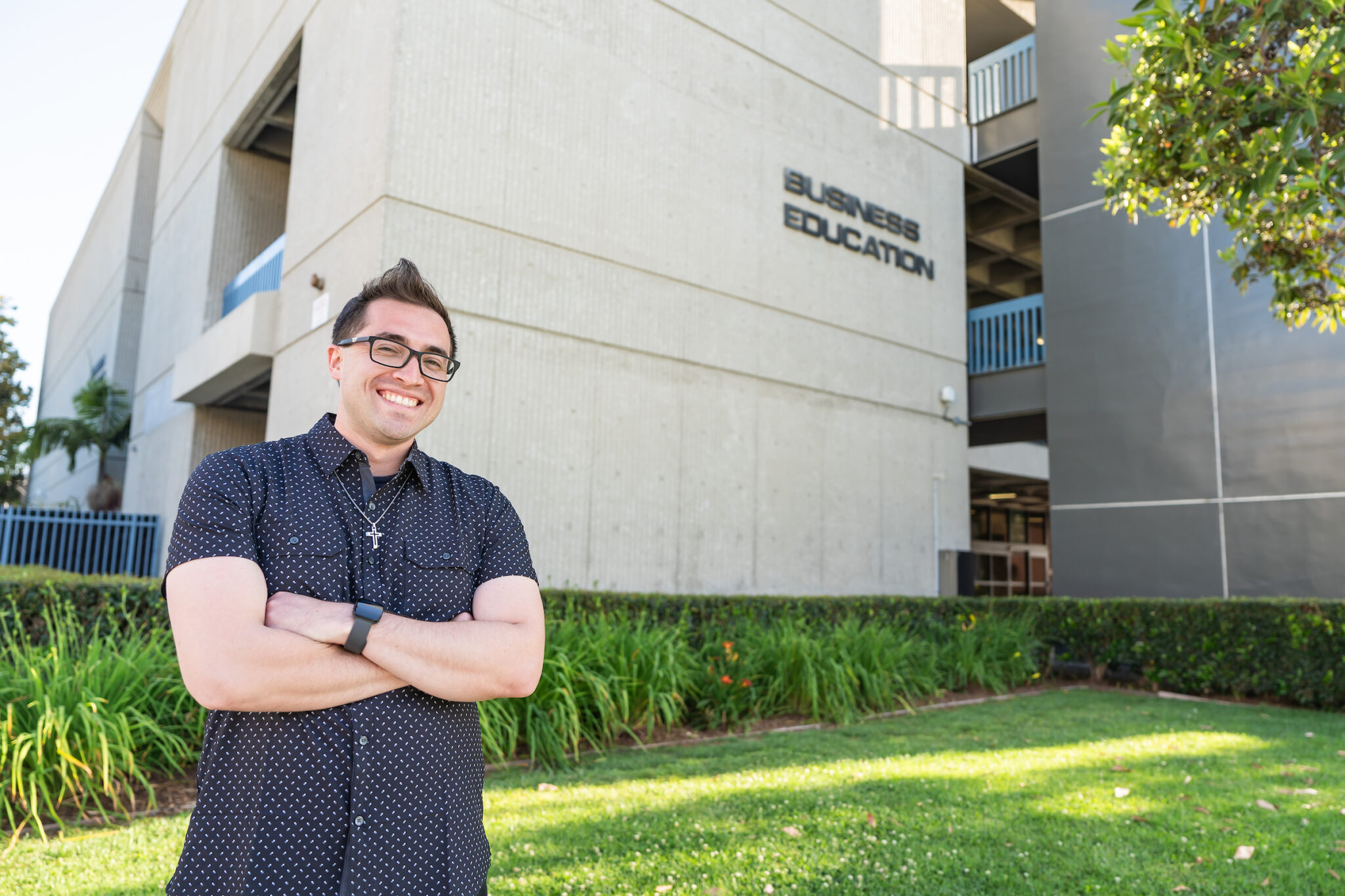 Taylor Schutt in front of the Business Education building at Cypress College